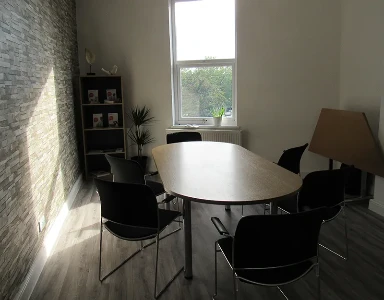 meeting room with large round table and chairs