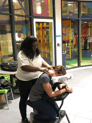 lotoya giving lady a neck massage