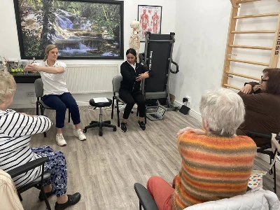 patients sitting down in falls prevention class