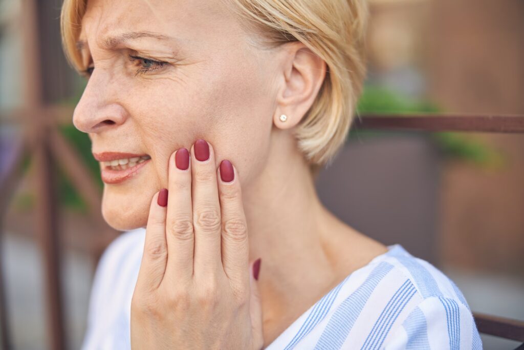 TMJ Disorder 3 low spirited short haired lady experiencing an acu 2024 10 18 09 47 57 utc converted